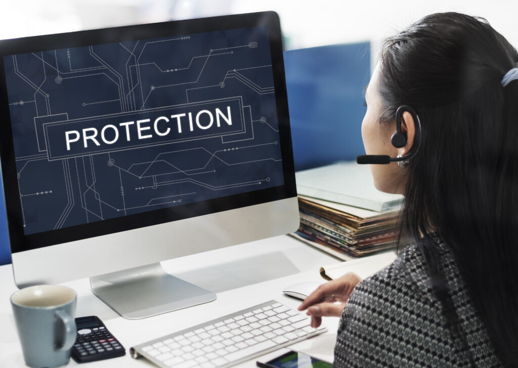 Woman wearing a headset fully protected from security vulnerabilities due to best practices being followed.